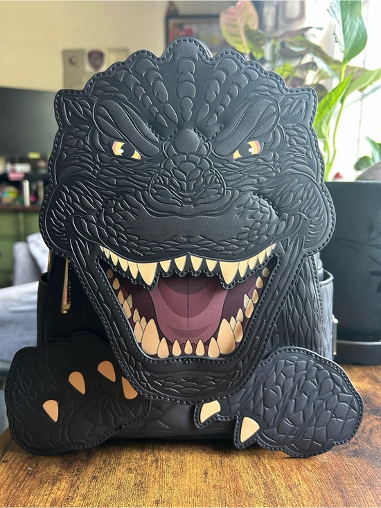 Loungefly Handbags - Loungefly Black Godzilla Face Backpack with Yellow and Cream Accents